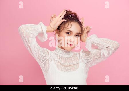 Asian happy portrait beautiful cute young woman teen stand surprised excited celebrating gesturing palms Stock Photo