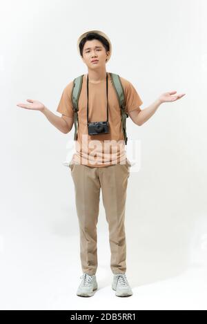 After travels. Positive nice man showing his empty pockets while being out of money Stock Photo