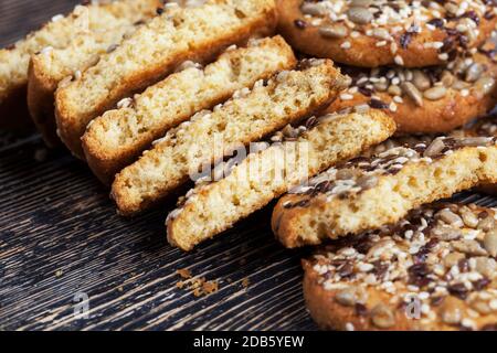 delicious fresh cookies made from high-quality oatmeal with flax and sunflower seeds and nuts, close-up of food broken into several parts Stock Photo