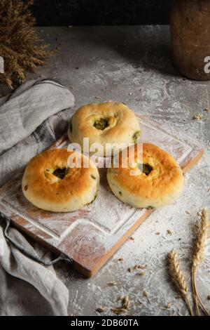 three cakes on wooden board and gray background Stock Photo