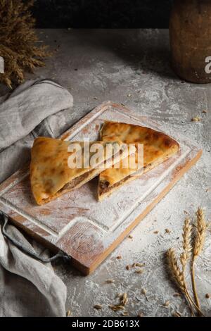 three cakes on wooden board and gray background Stock Photo
