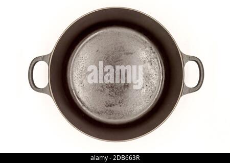 Cast iron pan with two handles top view on a white background Stock Photo