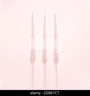 Christmas decorations shiny Christmas trees on pastel pink background. New Year holiday winter concept. Flat lay, top view, copy space. Vertical. Stock Photo