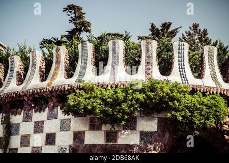 mosaic bench on stone gallery in the park Guell in Barcelona, Spain. Vintage retro style Stock Photo