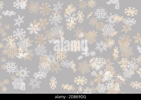 Beautiful snowflake pattern white and gold falling on a subtle pastel grey background Stock Photo