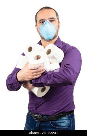 man with medical mask and toilet papers on white background Stock Photo