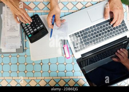 Business people paying bills online Stock Photo