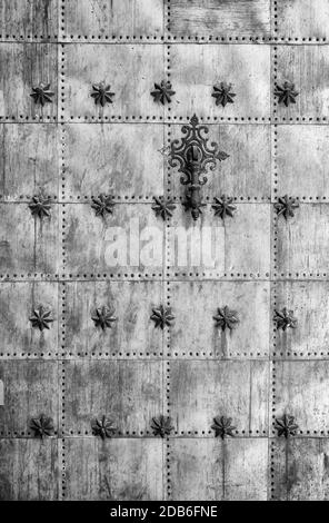 Metal door with decoration, detail of an old door in a church, Gothic and medieval decoration Stock Photo