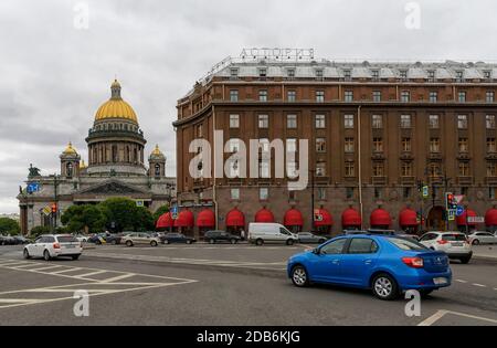 Saint-Petersburg, Russia – August 11, 2020: Cars on St. Isaac Square near the Astoria Hotel and St. Isaac Cathedral in the background Stock Photo