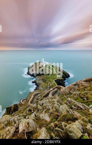 Curving stone path leading down to Southstack Lighthouse on the Anglesey Coast in North Wales, UK. Stock Photo