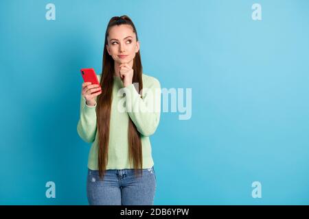 Portrait of her she nice attractive lovely creative minded brown-haired girl using gadget creating new post smm copy empty space isolated bright vivid Stock Photo