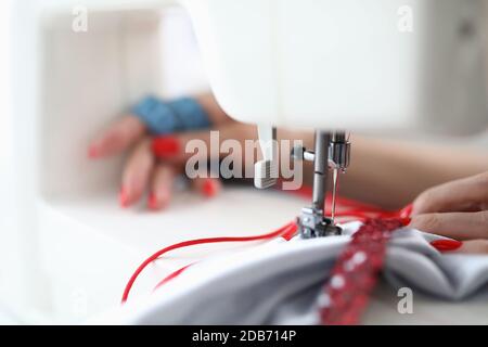 Detailed picture of seamstress at work Stock Photo