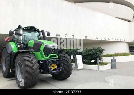 New York, United States. 15th Nov, 2020. A DEUTZ-FAHR 9340 TTV Warrior tractor is parked in front of the the Solomon R. Guggenheim Museum on 5th Avenue in New York on Nov. 15, 2020. The tractor is the entrance to Countryside, The Future, exhibition organized in collaboration with architect Rem Koolhaas and Samir Bantal, director of AMO, the think tank of the Office for Metropolitan Architecture. The exhibition runs until Aug. 14, 2020. (Photo by Samuel Rigelhaupt/Sipa USA) Credit: Sipa USA/Alamy Live News Stock Photo