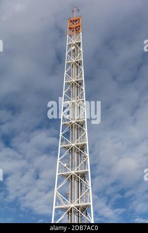 radio mast against cloudy sky Stock Photo