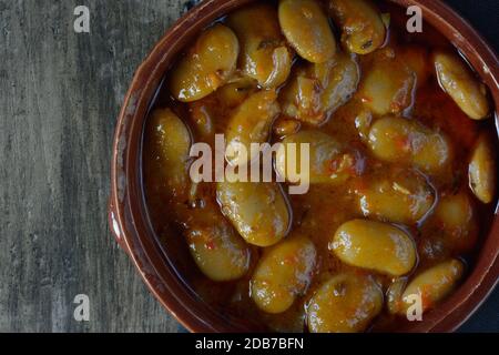 Greek butter beans, known as gigantes, in clay plate Stock Photo