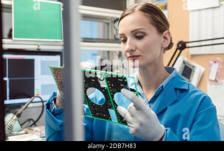 Optical quality control and assembly inspection of an electronic product in the factory Stock Photo