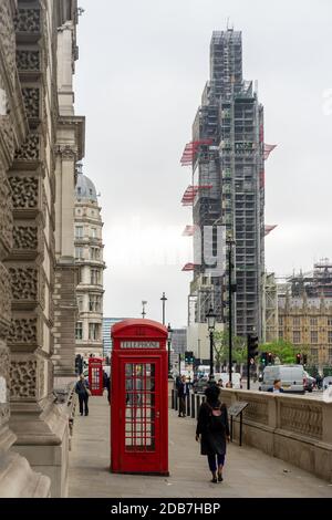 London telephone box and Big Ben covered with scaffolding Stock Photo