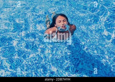Woman in swimming pool, Mallorca, Balearic Islands, Spain Stock Photo