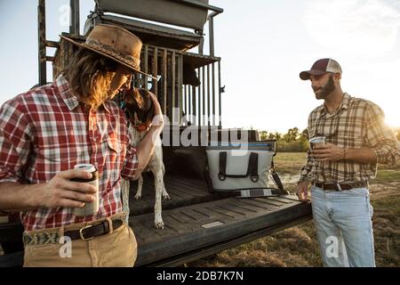 Two hunters with dog, Bear Creek Reserve, Georgia, USA Stock Photo