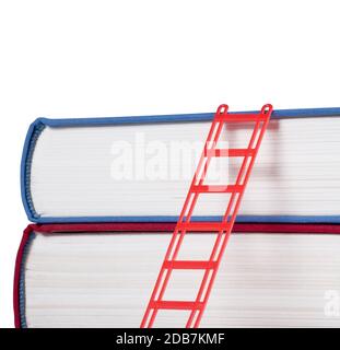 Books with a red ladder isolated on white background Stock Photo