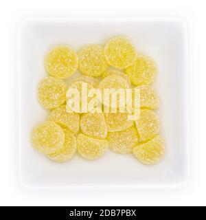 Green gum drops with eucalpytus and menthol in a bowl in top view Stock Photo