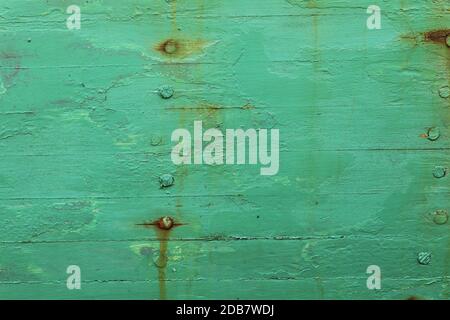 bright Green painted surface showing nails Stock Photo
