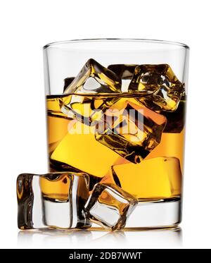 Glass of whiskey with ice and ice cubes lying isolated on white background Stock Photo