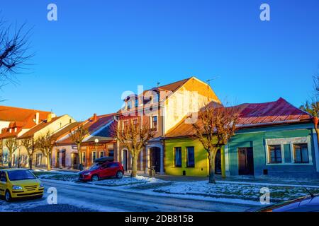 Colourful houses on the Main street of Kezmarok, Slovakia, a small town in Spis region, Poprad river. Stock Photo