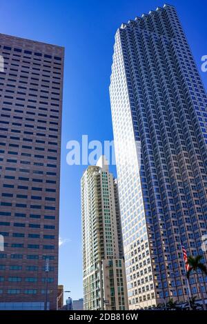 Miami, USA - November 30, 2019: Downtown Miami cityscape view with condos and office buildings against blue sky. Stock Photo