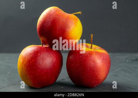 Apples on black stone table background. Front views Stock Photo