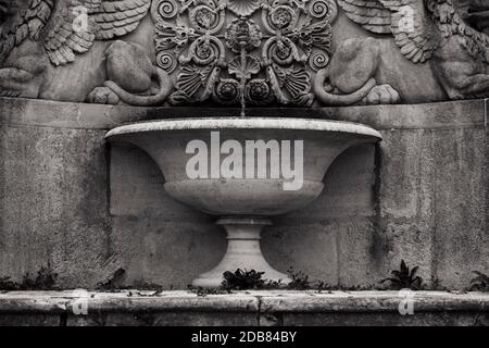 Old Stone Drinking Fountain In Black And White Photography Stock Photo