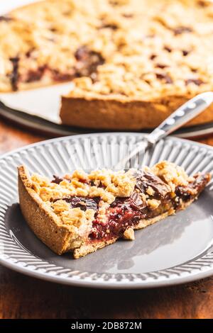Sweet plum pie. Piece of plum pie on plate. Stock Photo