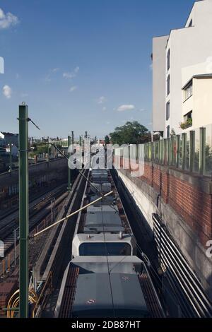 Subway Station Outdoors With Train Passing By Stock Photo