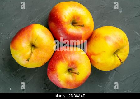 Apples on black stone table background. Front views Stock Photo
