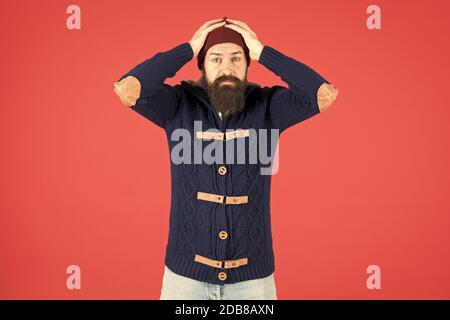 Mistake. Emotional expression. Casual clothes for winter season. Hipster with long beard. Hipster lifestyle. Stylish outfit hat accessory. Man bearded hipster stylish fashionable jumper and hat. Stock Photo