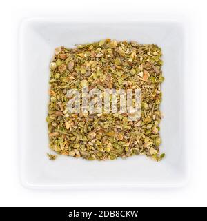 Dried rubbed oregano spice in a bowl in top view Stock Photo