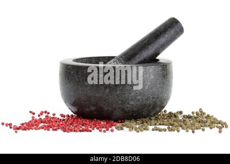A side view of peppercorns with mortar and pestle isolated on white Stock Photo