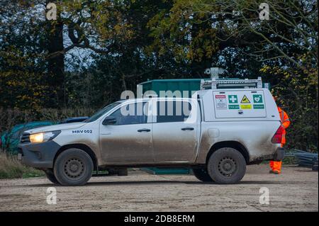 Aylesbury Vale, Buckinghamshire, UK. 16th November, 2020. The CCTV cameras on the top of an HS2 surveillance truck point towards a lone female photographer on a public footpath taking photos of a huge old oak tree destroyed by HS2. HS2 continue to regularly film members of the public and press near to their sites for 'profiling' purposes. Credit: Maureen McLean/Alamy Live News Stock Photo