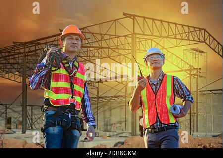 Two engineers on a construction site, Thailand Stock Photo