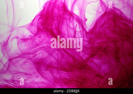 Pink Color drops in water background Stock Photo