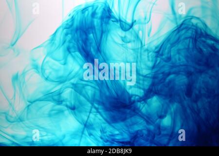 Blue Color drops in water background Stock Photo