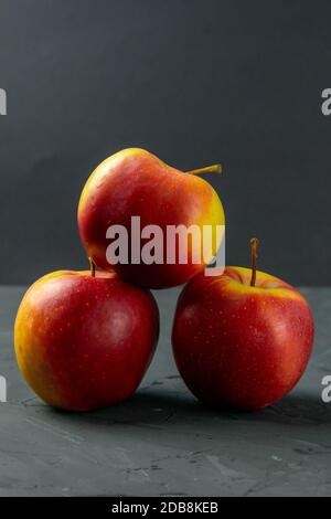 Apples on black stone table background. Front views Stock Photo