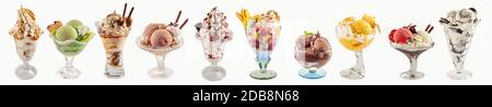 An assortment of ice-cream sundaes on a white background with copy space. Stock Photo