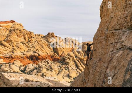Climber on a wall at Red Rock Canyon, Nevada Stock Photo