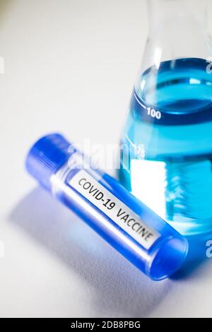 Conceptual image of a recipient containing a vaccine for coronavirus ...