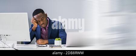 Banner Of Tired African Businessman Sleeping In Office Stock Photo
