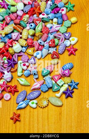Colorful plastic craft beads pieces assortment variety Stock Photo