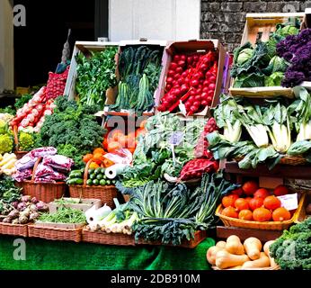 Fresh vegetables sold on nicely arranged market stall Stock Photo