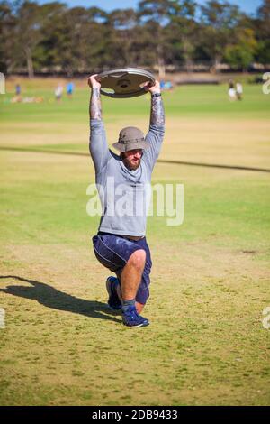 Man doing lunges with weights Stock Photo