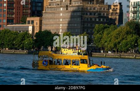 London Duck Tours on the River Thames carrying tourists in London.  DUKW,or Duck,is six-wheel-drive amphibious truck first made US mid-1940s.21,000 we Stock Photo